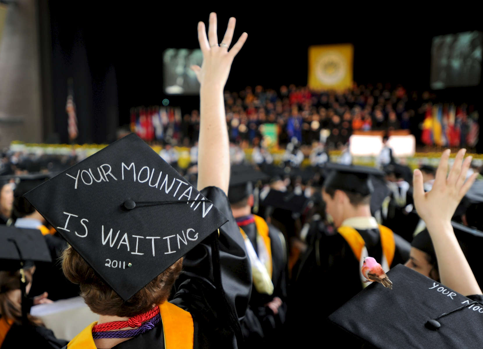 Jason McKibben - jmckibben@poststar.comSkidmore graduate Colleen Hughes sports a quote from the Dr. Seuss book \{quote}Oh, The Places You\'ll Go!\{quote} on her mortarboard during the school\'s 100th commencement exercises Saturday, May 21, 2011, at the Saratoga Performing Arts Center. 