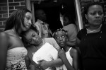  Sharonda Melvin, the mother of a 17 year old killed Saturday at MLK Blvd and Kinney St. in Newark, NJ is comforted at home Sunday afternoon surrounded by family members Angela Gainer (left), Chante Gedeon (center) and Sharon Melvin (right).   Photographed for The Star-Ledger