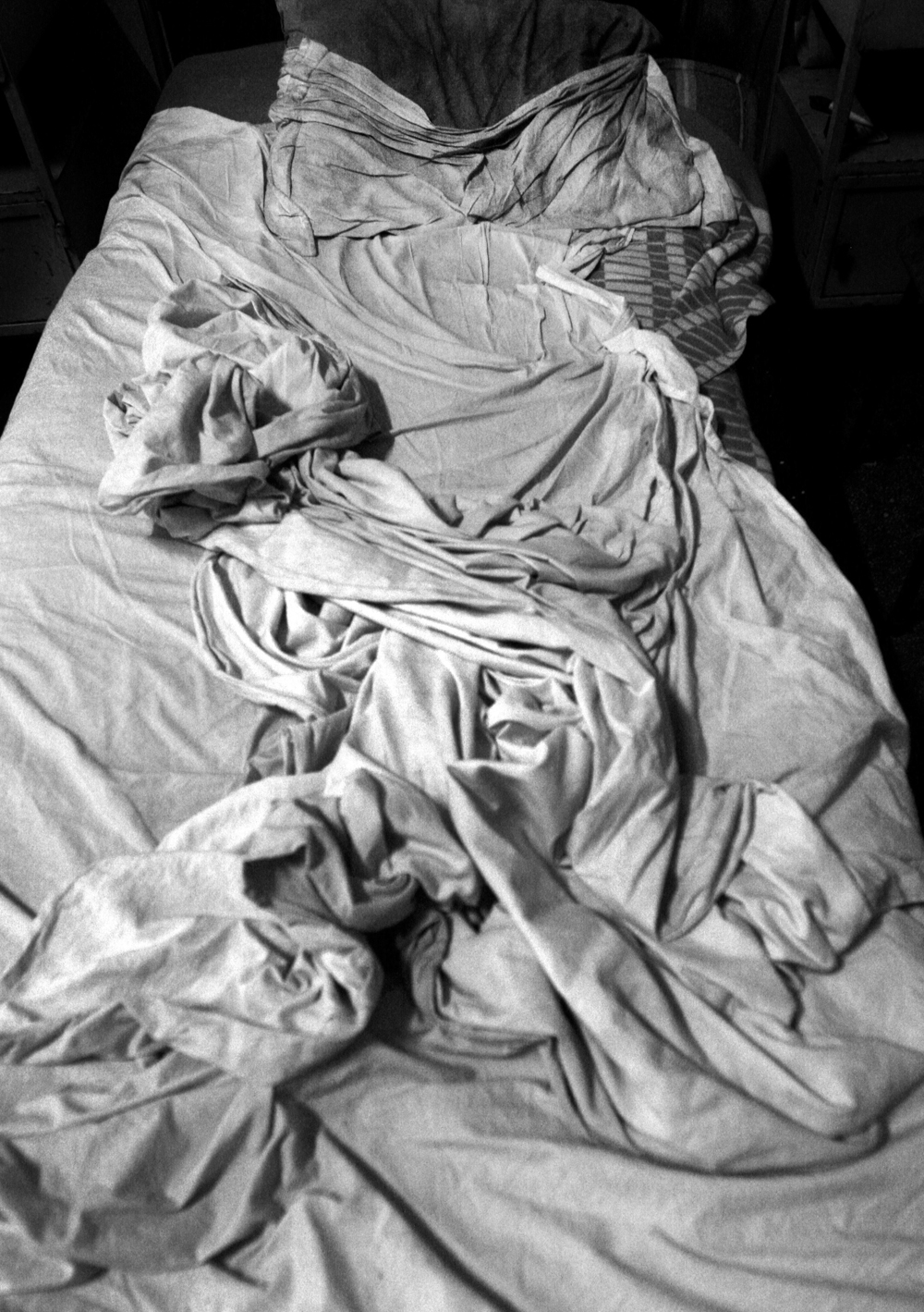Dirty sheets lay crumpled on a patient's bed in the psychiatry ward of a county hospital in Bulgaria on August 23, 2007. 