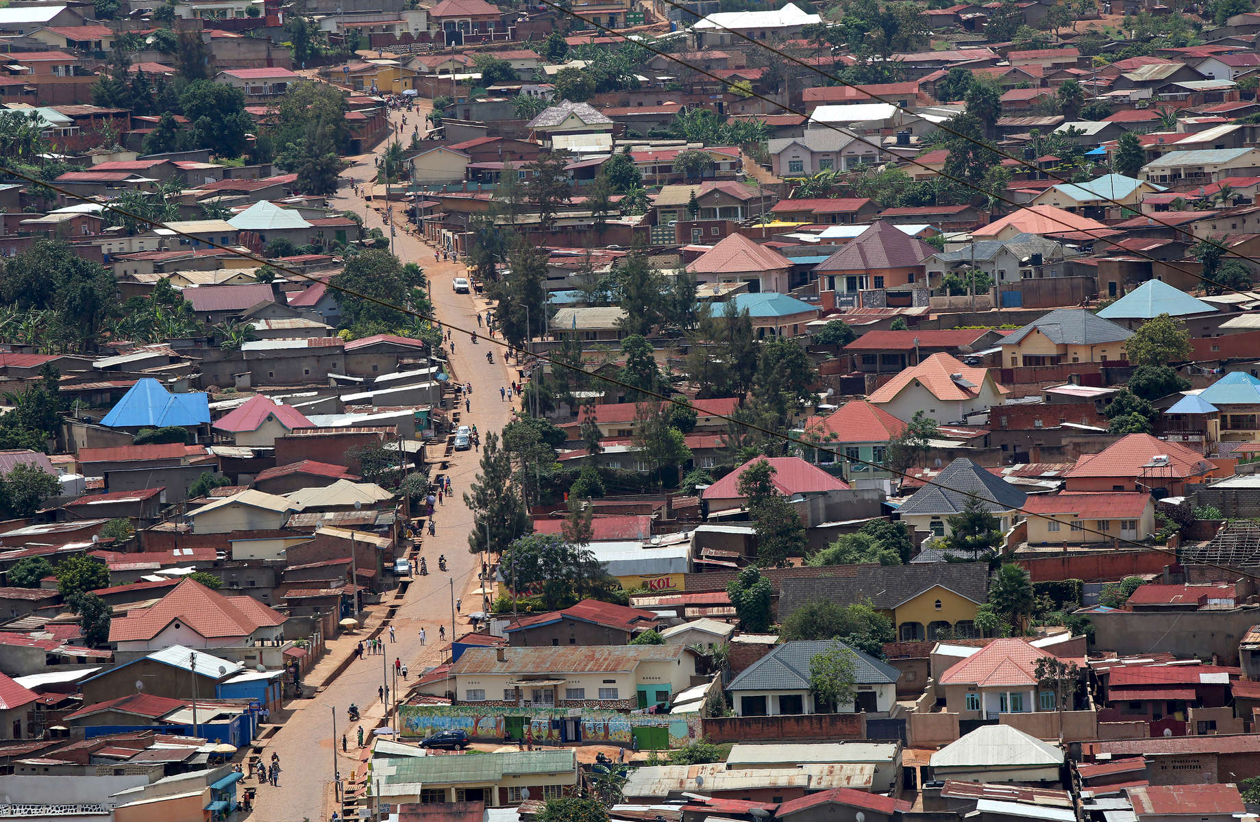 A road snakes through Kigali, Rwanda on November 19, 2017. The land-locked African nation relies on hydropower and wood-burning for its energy, emissions from which combine with automotive and bike exhaust to form a blanket of pollution. While Rwanda is making an effort to source more climate-friendly fuels, the country has already experienced temperature increases higher than the global average, which are projected to continue to rise by 2.5 degrees C from its 1970 temperatures, by the 2050s. Nearly half of all Rwandans live in poverty, relying on small-scale farming for survival without gas or electricity. With so many women and children spending hours of the day foraging for wood used for cooking and light, often damaging their eyes, lungs, the forests and atmosphere, a little inventiveness helps. Enter cow and enter pig -- not just as a source of food, but also the heat needed to cook it. Or more specifically, their poo -- the fuel fed to a biogas digester, a tank that converts organic waste into methane. 