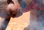 Smoke rises as twelve-year-old Sandra Gihozo blows onto a pot of beans, stoking the wooden fire beneath it in Mount Kigali village in Rwanda, on November 12, 2017. Her aunt Ruth Uwamahoro says Sandra's eyes and throat often hurt from the smoke, and that wood gathering sometimes makes her miss schoolwork.Nearly half of all Rwandans live in poverty, relying on small-scale farming for survival without gas or electricity. With so many women and children spending hours of the day foraging for wood used for cooking and light, often damaging their eyes, lungs, the forests and atmosphere, a little inventiveness helps. Enter cow and enter pig -- not just as a source of food, but also the heat needed to cook it. Or more specifically, their poo -- the fuel fed to a biogas digester, a tank that converts organic waste into methane. 