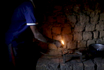 Etiene Twagirayezu, 60, lights his biogas digester in his home on November 18, 2017 in Rutabo, Rwanda. Twagirayezu says that before his digester, he'd spend up to 3 hours a day gathering 10 kilograms of wood, and saw kids get injured climbing trees and be late to school doing the same. He added he was happy his workload at home was reduced due to being able to use his cow's and pig's poo instead of wood as fuel, as well as about the resulting lessening of deforestation. Nearly half of all Rwandans live in poverty, relying on small-scale farming for survival without gas or electricity. With so many women and children spending hours of the day foraging for wood used for cooking and light, often damaging their eyes, lungs, the forests and atmosphere, a little inventiveness helps. Enter cow and enter pig -- not just as a source of food, but also the heat needed to cook it. Or more specifically, their poo -- the fuel fed to a biogas digester, a tank that converts organic waste into methane. 