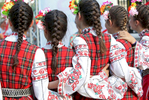 Members of the dance ensemble Arsenal, from Kazanlak, Bulgaria, prepare to dance on stage during an International Folklore Festival on June 02, 2018, the second day of the three-day Rose Festival in Kazanlak, a town situated in the Rose Valley of Bulgaria. The festival celebrated 115 years in 2018.  Photo by: Yana Paskova for National Geographic Traveler