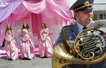 A band plans as Rose Queen Mihaela Hadzhieva, 18 (center,) poses for pictures alongside Bianka Nyagalova,18 (left,) and Elitza Slavcheva, 18 (right,) respectively second and first runners-up for Rose Queen in the Rose Festival in Kazanlak, a town situated in the Rose Valley of Bulgaria, during {quote}The Wisdom of the Rose{quote} parade, on June 03, 2018. The festival, situated in the Rose Valley of Bulgaria, celebrated 115 years in 2018. Photo by: Yana Paskova for National Geographic Traveler