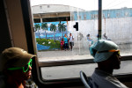 A bus transports its passengers to Mariel, a port city whose tranquil appearance belies its important place in both the history and future of Cuban-American interaction. Here is where the Russian navy unloaded its nuclear warheads in the 1962 Cuban missile crisis, as well as the site of the famous Mariel Boatlift of 1980, when 125,000 Miami-bound emigres fled the island during a 6-month lift on travel restrictions to the U.S.Now, Mariel's largest development project in history - a deepwater container port and a free-trade zone - aims to attract foreign investment, especially that of the U.S. A critical ingredient for its success will be the status of the U.S. embargo against Cuba, in place for more than 50 years, but now under speculation of being lifted. 