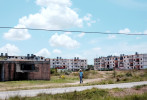 Apartment blocks with a crumbling infrastructure are seen in the provinces on the way to the port city of Mariel, Cuba, on April 19, 2015. Statistics label 7 out of every 10 Cuban houses in need of major repairs, with the province surrounding the capital requiring approximately 300,000 more inhabitable properties.Mariel's tranquil appearance belies its important place in both the history and future of Cuban-American interaction. It is where Russians unloaded nuclear warheads in the 1962 Cuban missile crisis, and the gateway through which 125,000 Miami-bound emigres fled during the Mariel Boatlift of 1980. The town is now the site of construction of a deepwater container port and a free-trade zone, a critical ingredient for which will be the future of the U.S. embargo against Cuba, in place for more than 50 years but now under speculation of being lifted. 