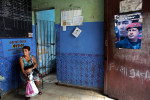 A woman waits her turn at a bodega in Havana, Cuba, near a photo of former Venezuelan President Hugo Chávez, with whom Cuba used to share a trade relationship and a distaste for American capitalism. Bodegas provide food rations - basics like rice, flour, sugar and beans, that exclude green veggies, most meat, spices or dairy (which is restricted to all but children and pregnant women) - to each Cuban citizen via the Libreta de Abastecimiento (supplies booklet,) which establishes the kind, amount and frequency of food allotted per person. The rations, which supply approximately 1/3 of Cubans' food requirements, have been kept at stable, subsidized prices since the program's inception in 1962 - as food can otherwise be forbiddingly expensive, and even at bodegas, hard to come by. This is due to a combination of inefficient farming policies, the U.S. embargo (in place since the 60s,) and the collapse of the Soviet Union in the 90s (which until then had filled the U.S.-Cuba trade vacuum with subsidies.) Food shortages, while common today, were especially sharp then, both in Bulgaria and Cuba, as the two countries tried to adjust to a non-Soviet-sponsored economy. 
