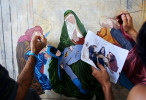 (L-R) Artists Angel León, 24, and Victor Manuel Ojeda, 24, work on nuancing a painting done by painter Eduardo Abela, 52, in Havana, Cuba, that satirically references the cult of action heroes by replacing religious figures with Western cartoon characters in copies of theological paintings. Art during the Communist years in Eastern Europe was highly sanitized - and artists who chose not to show a utopian view of the country, censored and punished. Artists in state-run Cuba as well have felt pressure to sanitize political issues and any difficulties the Cuban people may face, or omit them altogether. While the more open era of Raúl Castro has made it easier to toe the line in these areas of self-expression, artists who cross it altogether risk losing the support of government-controlled galleries that display their works.