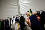 A model gets dressed before the Davidelfin show during the last day of the Mercedes-Benz Spring 2011 Fashion Week at the Lincoln Center on Thursday, September 16, 2010. (For The New York Times)(For The New York Times)