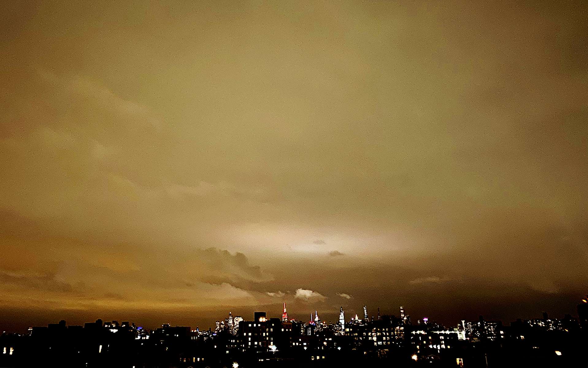 The sun sets over a quarantined New York City. I've heard yellow and orange rarely are popular colors. Some say this is because their luminous spectrum drains the eye of energy, while others associate a mustard hue with warning or disease. (March 2020, Brooklyn, NY.) 