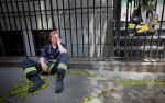 New York City Fire Department firefighter Terence O'Donnell rests after working on the scene of a crane collapse on Manhattan's Upper East Side at 91st Street and 1st Avenue on May 30, 2008 in Manhattan, New York. The crane collapsed on top of an apartment building crashing into a penthouse apartment and falling to the ground. (For Getty Images)