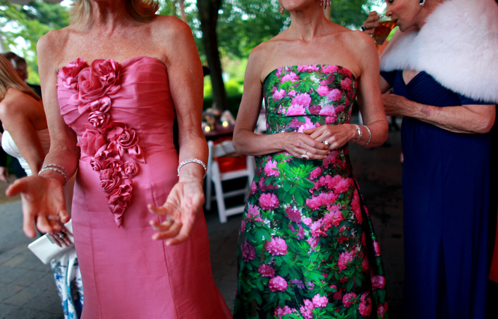 Guests mingle at the Conservatory Ball under a tent set up in The New York Botanical Garden in the Bronx, New York on Thursday, June 06, 2013.(For The New York Times)