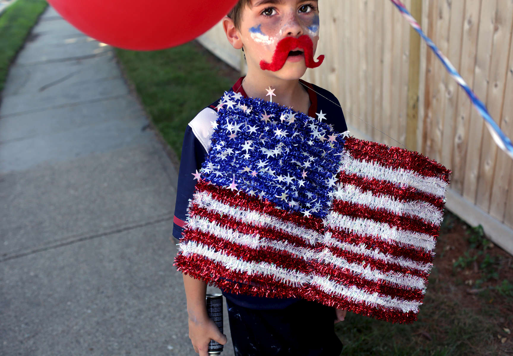 Ike Hedberg, 7, son of Mikie Sherrill, a Navy Pilot and former federal prosecutor who is running for Congress, exits the Fourth of July Parade in Montclair, NJ on July 04, 2017.(For The New York Times)