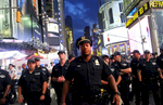 Police watch activists protest in Times Square in response to the recent fatal shootings of two black men by police, July 7, 2016 in New York, NY. Protests and public outcry have grown in the days following the deaths of Alton Sterling on July 5, 2016 in Baton Rouge, Louisiana and Philando Castile on July 6, 2016, in Falcon Heights, Minnesota. (For Getty Images)