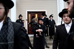 A crowd gathers for Hachnosas Sefer Torah in front of 47 Forshay Road in Monsey, NY, on December 29, 2019, where suspect Grafton Thomas, 38, stabbed 5 people at a Hanukkah gathering the previous evening. Anti-Semitic attacks are on the rise around the country — and in New York City, anti-Semitic crimes have risen by 21 percent in the past year, according to the Anti-Defamation League. (For The New York Times)