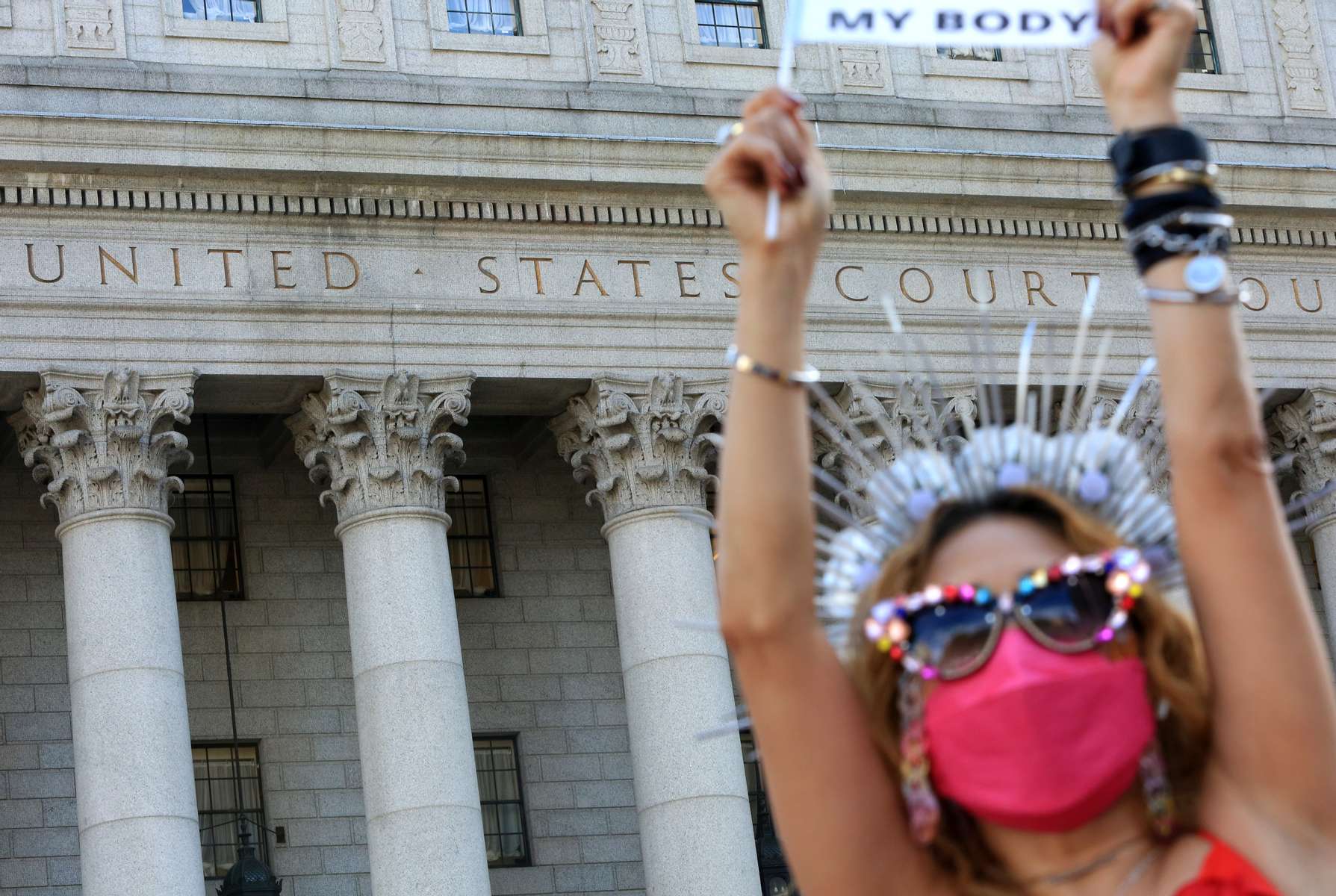 A woman holds up a sign as crowds gather in Foley Square in front of the United States Courthouse during the Women's March on October 2, 2021 in New York, NY. Marches were organized across the country to protest a new, restrictive Texas abortion law that bans most abortions at six weeks of pregnancy. 