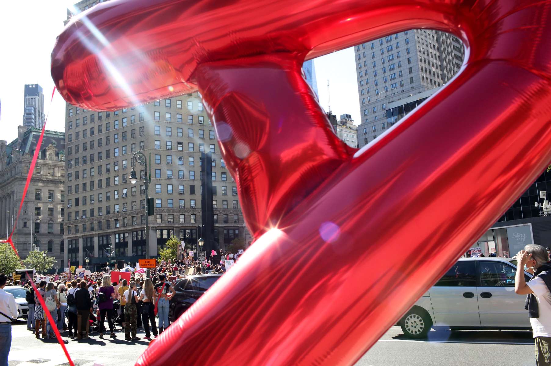 A “Scarlet A” balloon floats in the foreground of crowds gathering in Foley Square in front of the United States Courthouse during the Women's March on October 2, 2021 in New York, NY. Marches were organized across the country to protest a new, restrictive Texas abortion law that bans most abortions at six weeks of pregnancy. 