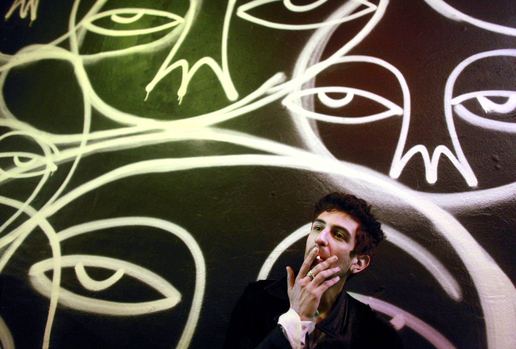 Designer Dominic Louis smokes a cigarette outside of a party at The Electric Room at the Dream Downtown hotel in Manhattan, NY, on February 14, 2013, the last day of New York Fashion Week. (For The New York Times)