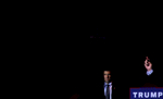 (L-R) A Secret Service agent surveys the crowd as U.S. Presidential candidate Donald Trump (R-NY) speaks at a rally at Sunset Cove Amphitheater in Boca Raton, FL, on March 13, 2016.(For TIME magazine)