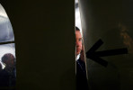 A member of the Secret Service peeks the the outside world from the tent where Republican Presidential candidate Mitt Romney (R-MA) spoke near the Montgomery Inn Restaurant at The Boathouse in Cincinnati, Ohio on Saturday, March 03, 2012.(For The New York Times)
