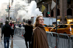A passerby gazes at Trump Tower, the current residence of Republican President elect Donald Trump, in Manhattan, NY on November 28, 2016.-“Trump Gawkers{quote} is a visceral look at what draws people to Trump Tower, the current residence of U.S. President elect Donald Trump. Hoards of people undertake the trek, bearing security and weather roadblocks, to stare, gawk, absorb, record. The magnetism to the tower (and by extension, to the man inside it,) manifests in the sheer numbers of daily visitors, as well as in the fascination etched across their faces. Upon first look, the time so many spend there seems like sport and amusement, but underneath upturned eyes and selfie smiles prevails an undercurrent of anxiety - and not just for those who didn't want Trump in the Oval Office. Some of the electorate that voted against Hillary is now unsure for which version of Trump they voted. People's upward gazes, no matter their political views, seek answers: How could this happen? Or now that it has, what will it mean? 