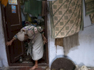 A widow exits her room at Pashupatinath Ashram in Varanasi, India on January 06, 2019.