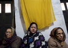 (L-R) Widows Meena Devi, 78, Sita Devi, 52, and Savitri Devi, who estimates she is 80 years old, sing and and pray at Rak Kuti ashram in Varanasi, India on January 07, 2019. Sita's mother-in-law, Goma Devi, who estimates she is 90 years old, also lives in the ashram.