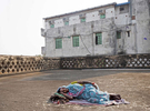 Sonakshi Devi, a widow, lies on the roof of the Durga Kund Help Line ashram in Varanasi, India on January 08, 2019. 