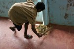 Samkuttia, who is intellectually disabled and was found working as a ragpicker when he was 9, sweeps the hallway during the daily cleanup.