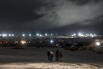 A group of women atop {quote}Facebook Hill{quote} at the Oceti Sakowin camp peer out towards the lights from the DAPL pipeline construction.
