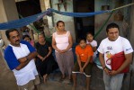 Umberto (far right), Mexfam youth promoter coordinator, meets with a promoter's family at their home.Working closely with the parents and families of the young promoters has been key in building support and acceptance of the program in the larger community.