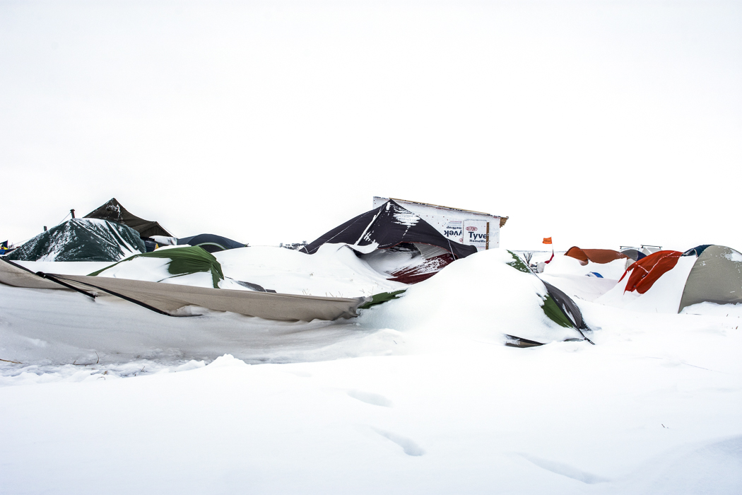 Abandoned, now they were becoming an abstraction on the landscape, slowly being buried under the snow. 