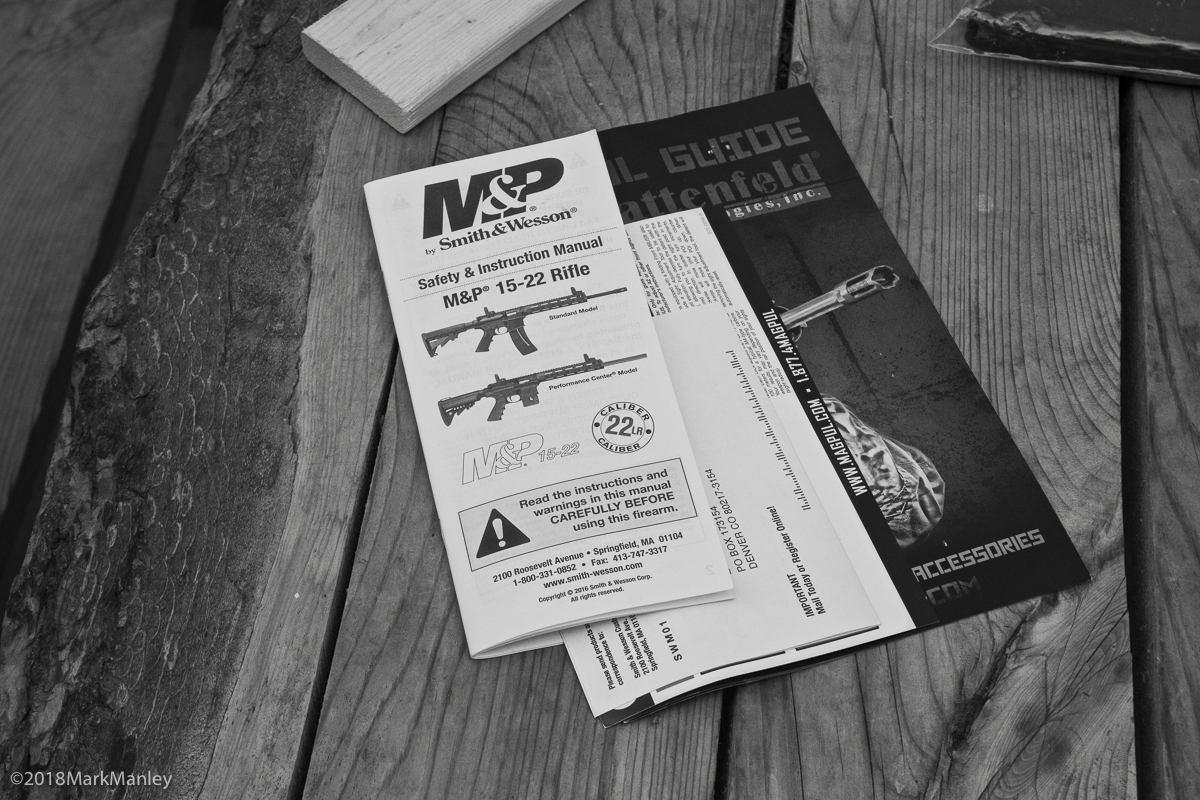 Printed safety materials lay on a picnic table next to the weapons check-in area. All weapons were inspected and zip-tied prior to being allowed to enter the church.
