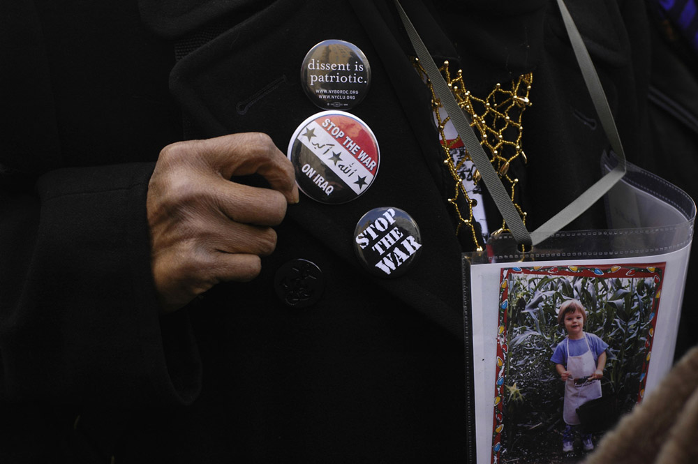 Members of Grandmothers Against the War frequently wear pictures of their grandchildren while demonstrating and standing vigil.