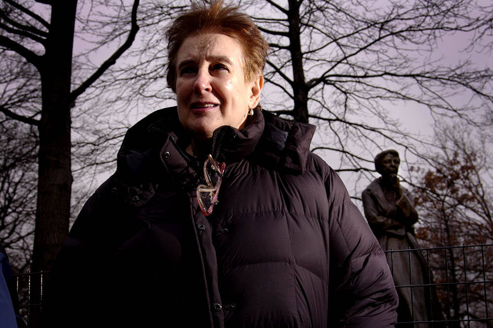 {quote}I was on the 104 bus on the westside and  this woman got on. She had a backpack on with a button: 'Where is the outrage?' And that was Joan (pictured standing in front of a statue of Eleanor Roosevelt near Riverside Park in New York City). We started talking and she told me about the Grandmothers Against the War.{quote}  Barbara Walker, GAW member, on meeting Joan Wile  founder of Grandmothers Against the War.