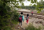 Middle School students from Nipher Middle School in Kirkwood walk a well worn path that leads them across a set of railroad tracks on their way home after school on Friday, Sept. 14, 2012.  Everyday more than a dozen students take the same path across the tracks as they walk both to and from school. Photo By David Carson, dcarson@post-dispatch.com