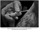 Richard Skinner shoots heroin on Monday, Feb. 6, 2017, into a vein near a tattoo he got during a stint in prison years earlier.  {quote}Heroin is the only thing that ever stole my soul. I'm not me anymore{quote} says Skinner.Photo by David Carson, dcarson@post-dispatch.com