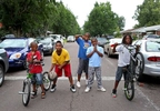 Friends Jaishyne Brister, 8, Jermell Sane, 11, Martez Bryant, 13, Armoni Whitaker, 10, and Chase Brister, 12, pose for a picture on Ward Drive in Ferguson a few blocks away from the honking and chants of protesters at the Mike Brown protests at the QuikTrip on Sunday, Aug. 17, 2014.