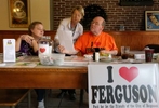 Elaine Wirt (left), Peggy Faul, and Brian Fletcher go over some paper work about the I â¤ FERGUSON committee at Corner Coffee House in Ferguson on Wednesday, Sept. 17, 2014. The committee that is selling the I â¤ FERGUSON shirts, buttons and yard signs recently received a letter from a man claiming the shirts violate his trademark on I â¤ FERGUSON.Photo By David Carson, dcarson@post-dispatch.com