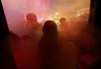 Members of the St. Louis County Police tactical team are engulfed in tear gas as they try to disperse a crowd near the Ferguson police station on S. Florissant Avenue in Ferguson on Monday, Nov. 24, 2014.Photo By David Carson, dcarson@post-dispatch.com