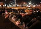 Protesters lay down in the street to block Lindell Boulevard at Whittier Street in St. Louis on Tuesday, Nov. 25, 2014.  About 100 people marched through the Central West End neighborhood occasionally blocking traffic but were peaceful in their demonstrations.  After a short while police ordered the protesters out of the street and they complied, got up and left the area.  They were protesting the grand jury's decision not to charge Darren Wilson in the shooting death of Micael Brown.Photo By David Carson, dcarson@post-disaptch.com