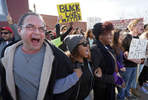 {quote}Black lives matter{quote} shout protesters Daniel Conford (left), Tracy Parks, Ashley Carter, Judy Lucas and Luke Davis(right) as they all link arms and face off to police at during a demonstration along Eager Road on Saturday, Nov. 29, 2014.Photo By David Carson, dcarson@post-dispatch.com