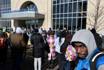 Protest leader Deray McKesson(right) stands in the crowd of protesters as police officers line up protecting the entrance to the St. Louis Police Headquarters after the police pushed out the crowd trying to rush in and occupy the lobby of the station on Wednesday, Dec. 31, 2014.  Photo By David Carson, dcarson@post-dispatch.com