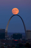 The supermoon rises over the Arch in St. Louis as seen from the Compton Hill Water Tower on Sunday, Nov. 13, 2016. The supermoon will peak on early Monday morning shortly before sunrise, it will be the nearest supermoon in almost 70 years and will be the largest  until Nov. 25, 2034. A supermoon happens when a full moon makes its closest pass to Earth appearing up to 14 percent bigger and 30 percent brighter in the sky. Viewing of the moon should also be good on Monday after the sun sets and the moon rises out of the east. Photo by David Carson, dcarson@post-dispatch.com