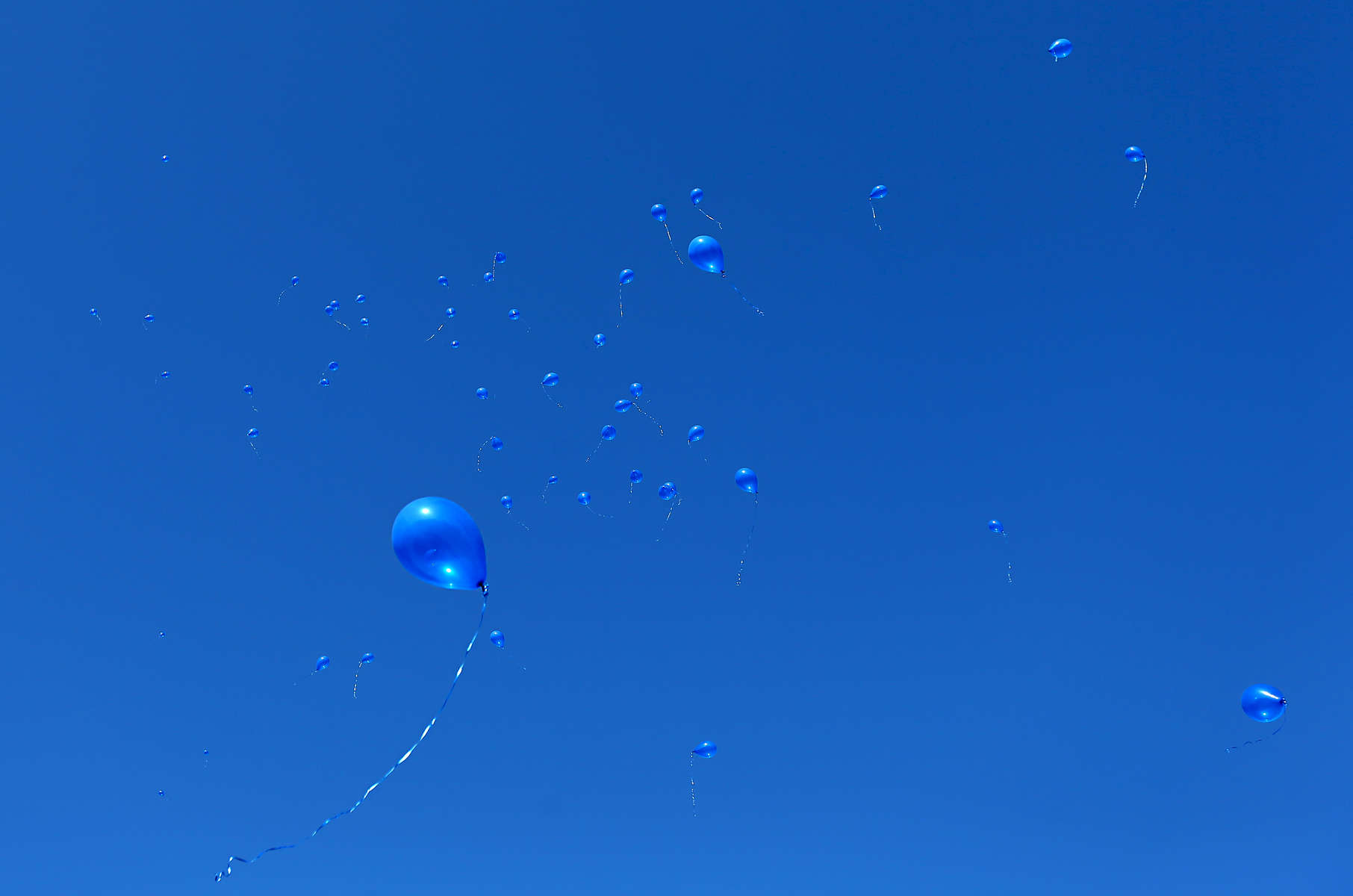 Blue balloons rise into the sky above Gilson Brown Elementary School in Godfrey on Thursday, Jan. 14, 2016 during emotional ceremony in memory of Romell Jones, a former student at the school. Romell, 11, was killed by a stray bullet fired from a passing car as he was waiting at the Alton Acres public housing complex for his basketball coach to pick him up for practice. All the students at the school gathered on the playground for a brief ceremony where Romell's fifth grade classmates released balloons in his memory and presented a few gifts to Romell's family who attended the event. Photo By David Carson, dcarson@post-dispatch.com