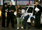 Toni Martin (center) cries out on Wednesday, Dec. 24, 2014 as she talks to police at the scene were her son Antonio Martin, 18, was fatally shot Tuesday Dec. 23, 2014 at a Mobil gas station on North Hanley Road in Berkeley. Photo By David Carson, dcarson@post-dispatch.com