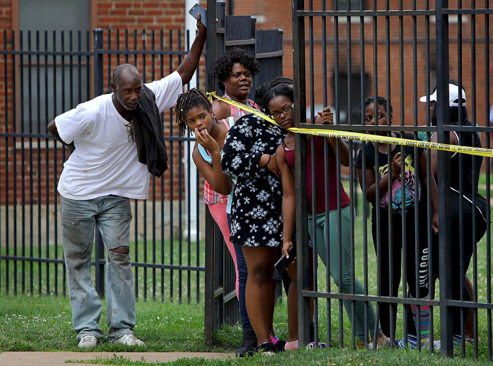 Residents watch as police investigate the scene of a fatal shooting in the 1400 block of Kealty Lane in St. Louis on Monday, Aug. 7, 2017. The suspect in the shooting returned to the shooting scene driving a minivan and surrendered to police.Photo by David Carson, dcarson@post-dispatch.com