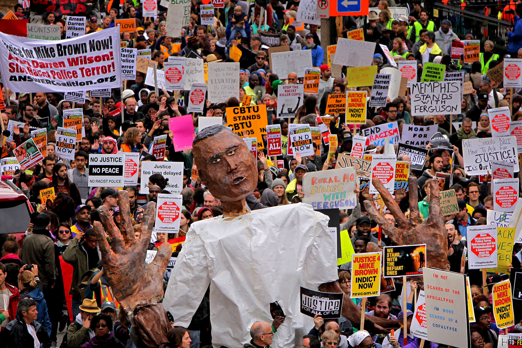 Thousands of protesters from around the country march towards Kiener Plaza in downtown St. Louis during the Ferguson October rally on Saturday, October, 11, 2014.  The unrest in Ferguson rising from the death of Michael Brown spread around the world on social media and was beginning to grown into a movement.