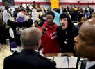 Joshua Williams (left center) and Nicholas Austin Jackson shout at St. Louis police chief Sam Dotson (left) as he tries to give a presentation during the second meeting of the Ferguson Commission in St. Louis on Monday, Dec. 8, 2014.  Some in the crowd stood and turned their back on Dotson as he spoke, others heckled him. Ferguson Commission member and Director of the Missouri Department of of Public Safety Dan Isom is pictured to the right. Isom was the St. Louis chief of police before Dotson.  The Ferguson Commission was created by the governor of Missouri to attempt to come up with solutions for the issues a raised by the Ferguson protests.