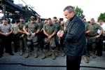 Reverend Michael Boehm says a prayer during roll call with police officers and St. Louis County Police tactical team as they make a plan for how to deal with crowds of people along W. Florissant Road in Ferguson on Monday, Aug. 18, 2014.Photo By David Carson, dcarson@post-dispatch.com